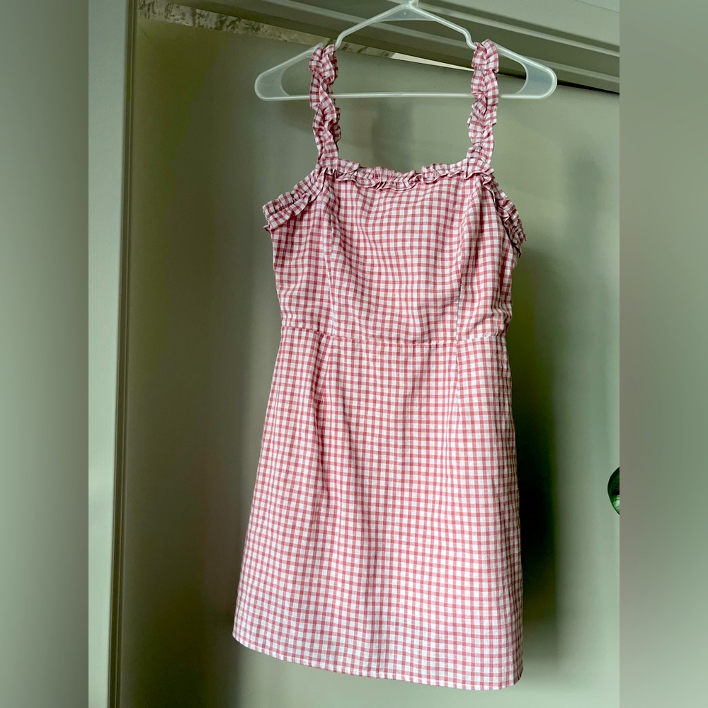 Pink gingham mini dress from Bloomingdale’s. Brand is Lost & Wander

Size Small